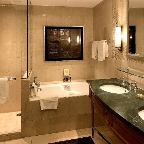 lavish marble en suite bathroom the four seasons nile plaza with bath, shower wc and twin basins